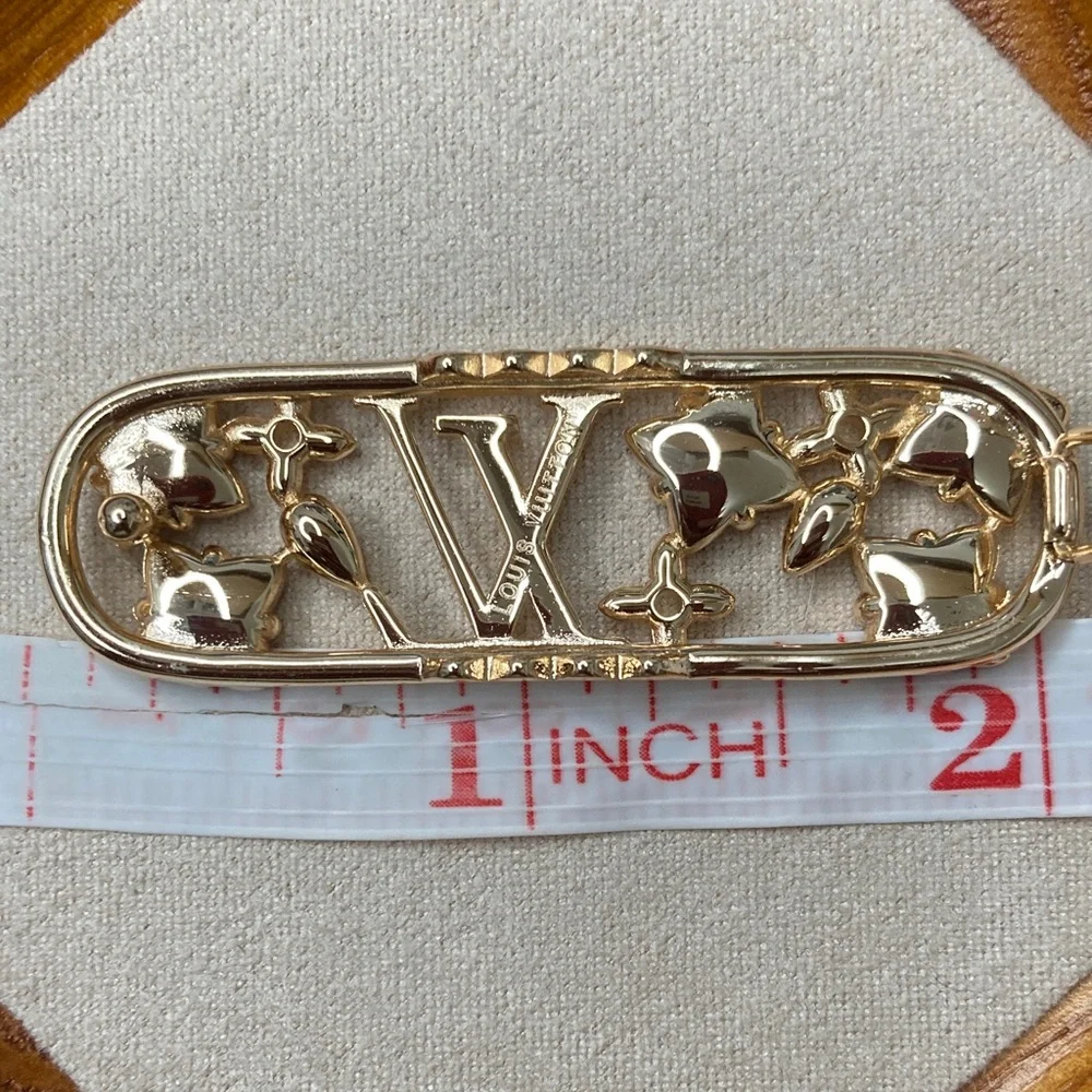 Louis Vuitton Gold Hair Clip with Red, Pink, and Silver Stars - Picture 3 of 3